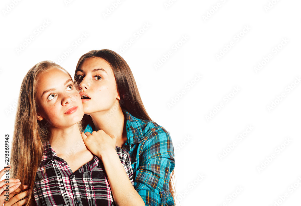 two cute teenagers having fun together isolated on white two cute teenagers having fun together isolated on white