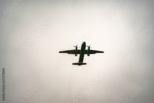 Aircraft on a background of cloudy sky. Landing a liner close-up. Spring. Day.