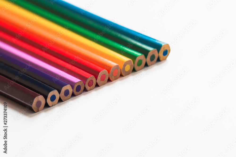pencils of colors of the rainbow lies on a white background, not sharpened pencils, bright colors, minimalism, new untouched concept pencils of colors of the rainbow lies on a white background, not sharpened pencils, bright colors, minimalism, new untouched concept
