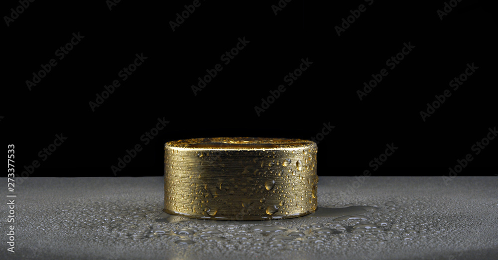 Blank golden color cover on an isolated yellow studio background, can be used for advertising and design Golden Tin Can On Isolated yellow Background Blank golden color cover on an isolated yellow studio background, can be used for advertising and design Golden Tin Can On Isolated yellow Background