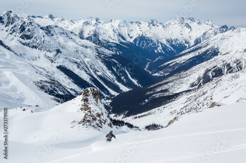 Skier starting down the Seven Steps to Paradise in Rogers Pass. 50 Classic Ski Descents of North America.