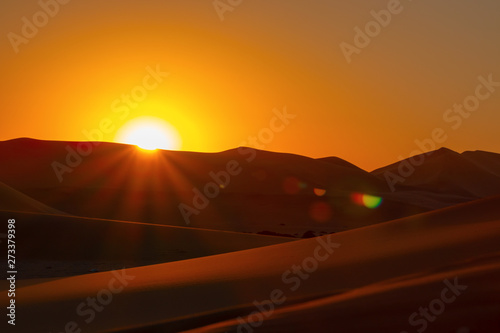 Sunset over the sand dunes in the Namib desert.