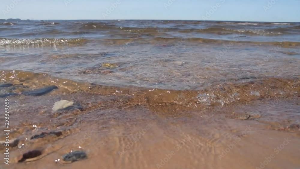 the sandy beach washed by the wave of the sea the sandy beach washed by the wave of the sea