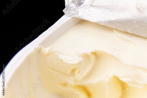 cream cheese with open lid