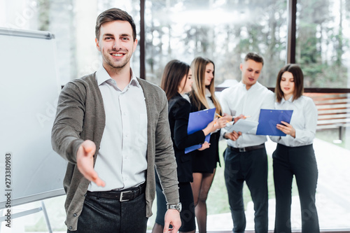 Businessman offer hand to shake as hello in office .Serious business, friendly support service, excellent prospect, introduction or thanks gesture, gratitude