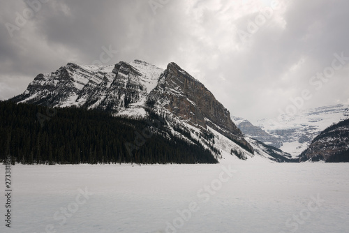 Photography Banff, Lake Louise, frozen Lake with snow on top and large mountains in the background