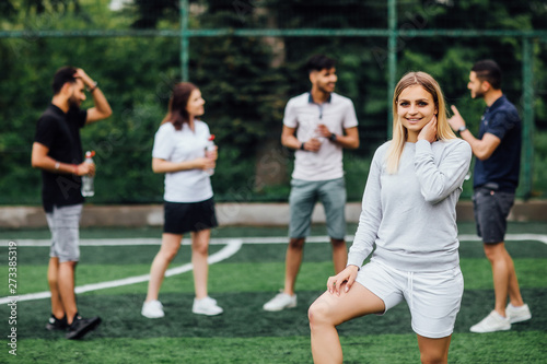 What about new palyer. Young, blonde  woman smiling and happy, football team. © Тарас Нагирняк