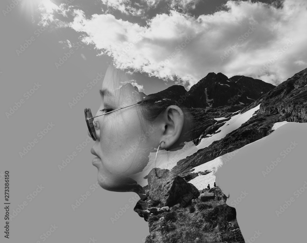 Fototapeta Black and white double exposure combined photographs with the Asian young woman wearing retro sunglasses and mountains.