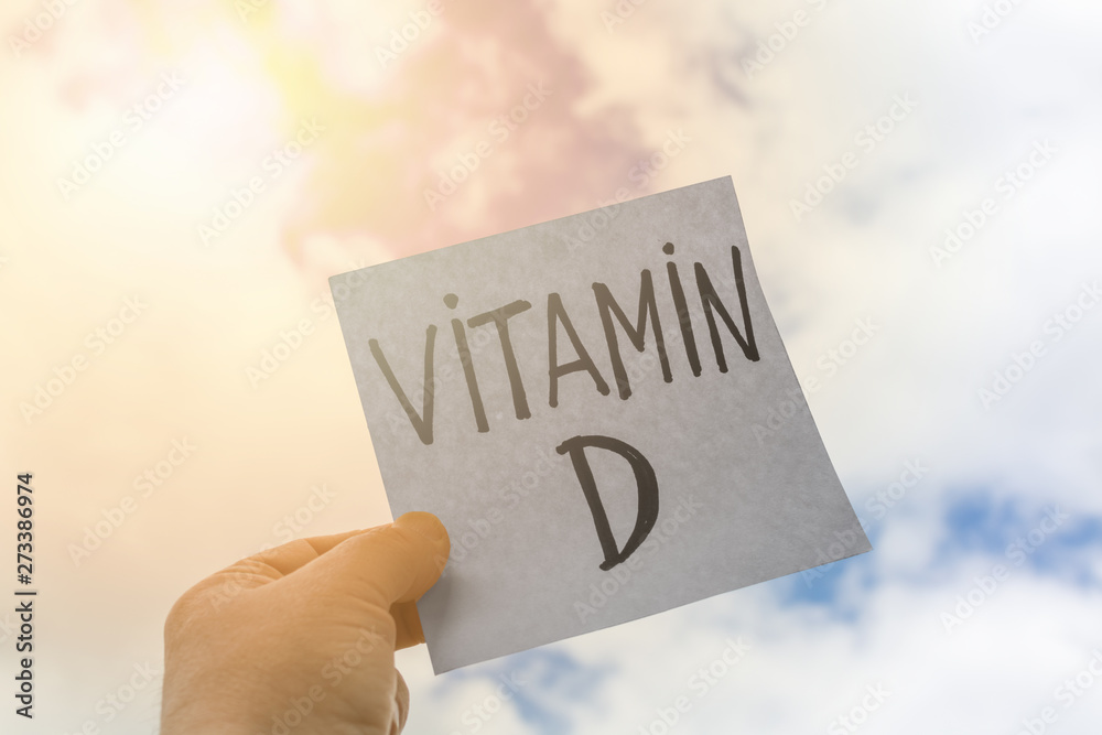 Plate with the inscription vitamin D on the background of nature