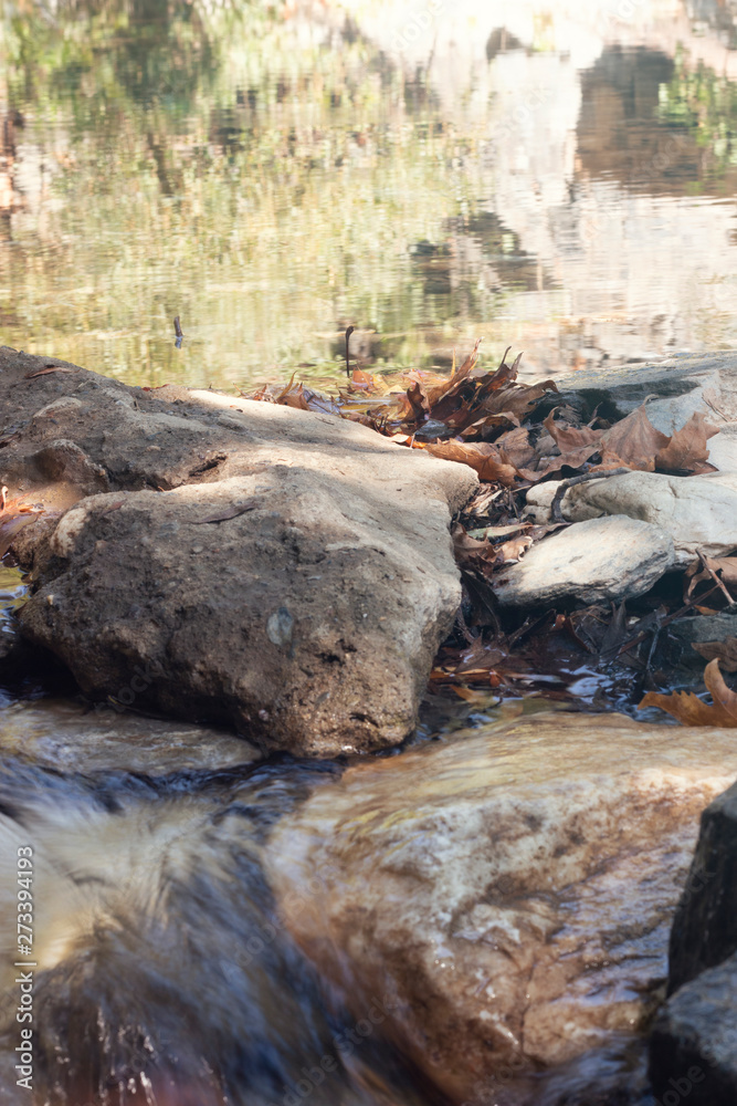 Obraz premium seaside with many rock, long exposure. long exposure of sea and rocks, aegean sea. ong exposure of stream and stony river