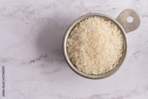 Shredded Coconut in a Measuring Cup