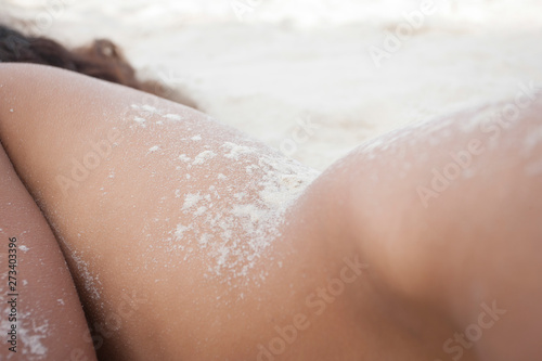 Nude beautiful girl in sand.