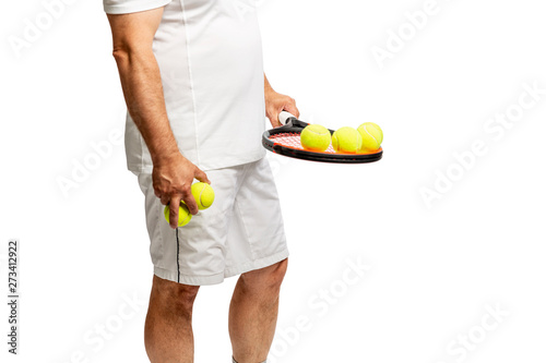 Middle aged man with racket and tennis balls. Isolated on a white background.