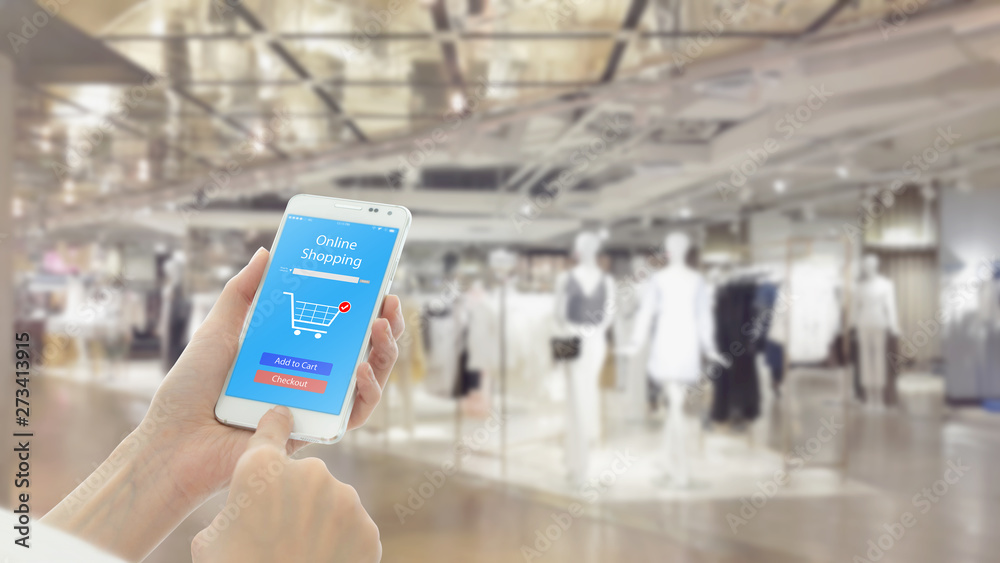 Woman using cellphone while shopping Woman using cellphone while shopping