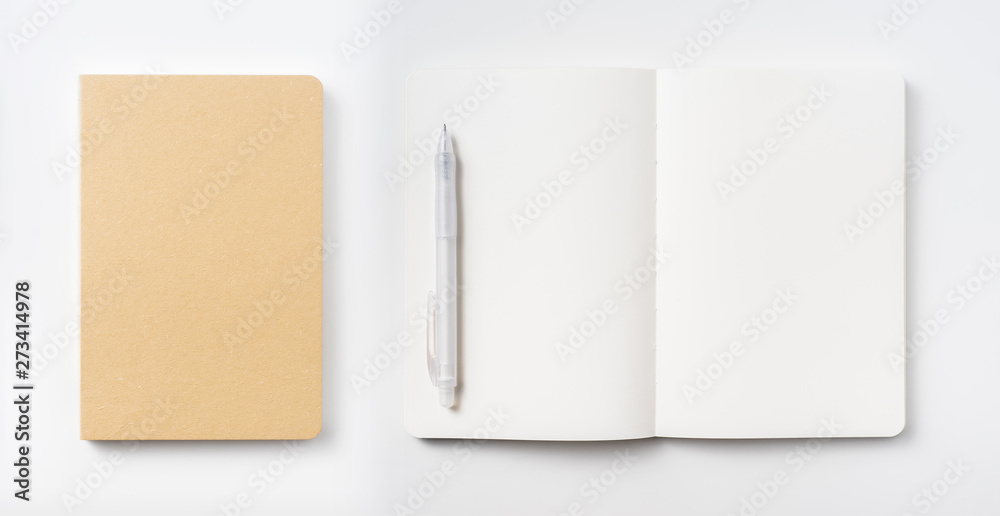 Top view of hardcover kraft notebook and pen Top view of hardcover kraft notebook and pen