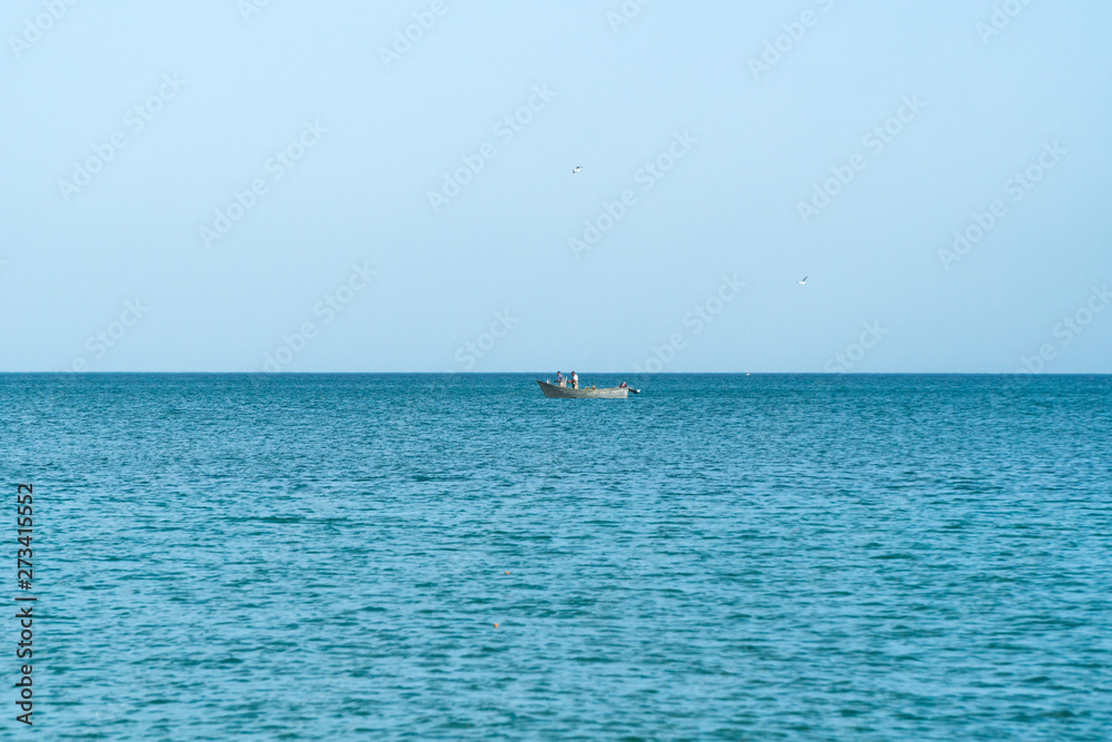 Boat with fishermen on the high seas
