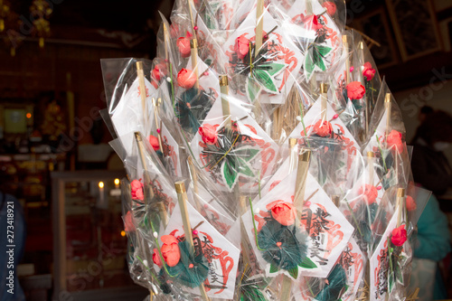 Holy amulet and jade accessory form talismans souvenir shop of Marishiten Tokudaiji Temple for people buying in Ameyoko Market at Ueno city in Tokyo, Japan photo