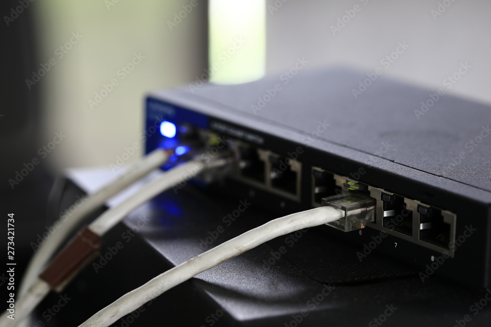 fiber optic Internet, Modem router network hub . cable connected router.  internet connection, data, speed test concept. ethernet cables plugged  close up. computer network technology Theme. Stock Photo | Adobe Stock