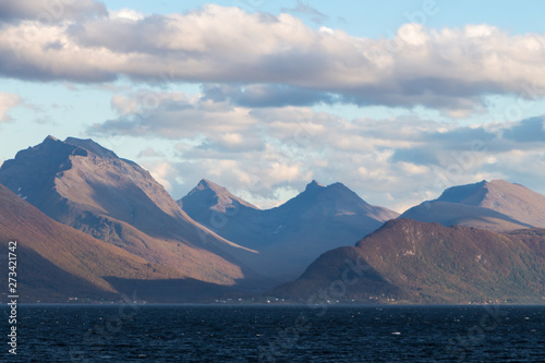 Norwegian fjords with rocky horizon at sunrise