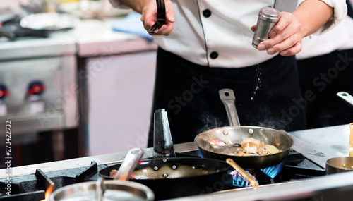 Chef cooking food in the kitchen  Chef preparing food