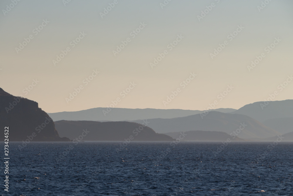 Norwegian fjords with rocky horizon at sunrise