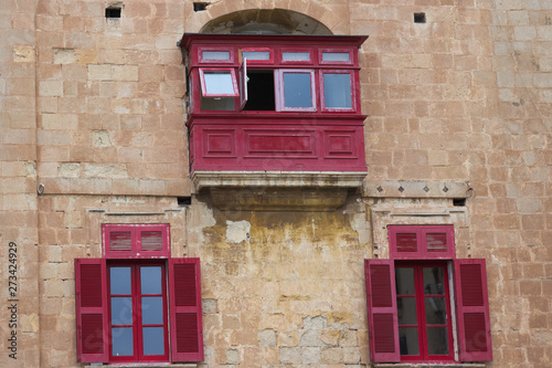 Typical maltese covered balcony and windows. photo