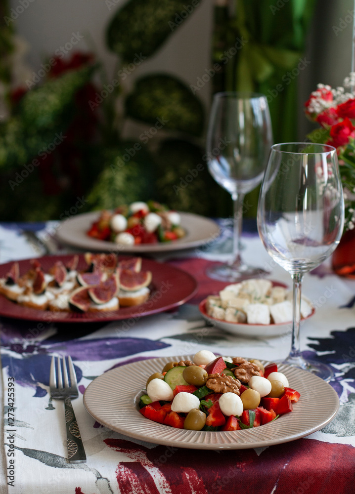 A fancy dinner for two: salad, brie cheese and white bread sandwiches. A fancy dinner for two: salad, brie cheese and white bread sandwiches.