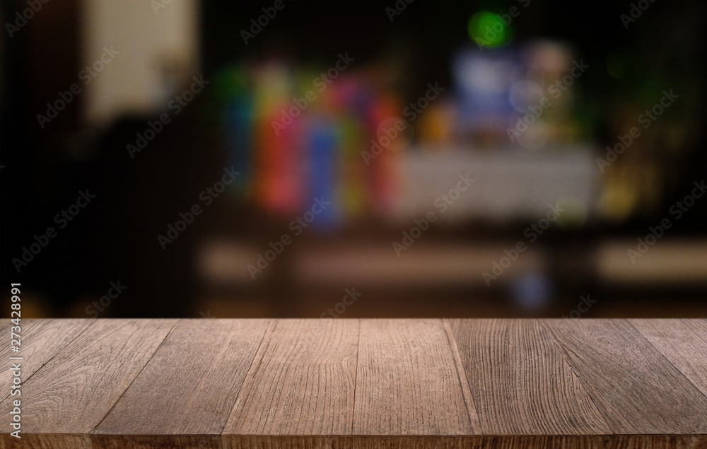 Empty dark wooden table in front of abstract blurred bokeh background of restaurant . can be used for display or montage your products.Mock up for space. Empty dark wooden table in front of abstract blurred bokeh background of restaurant . can be used for display or montage your products.Mock up for space.