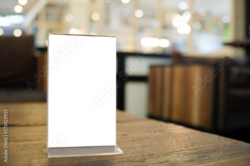 Menu frame space for text marketing promotion standing on wood table in Bar restaurant cafeใ