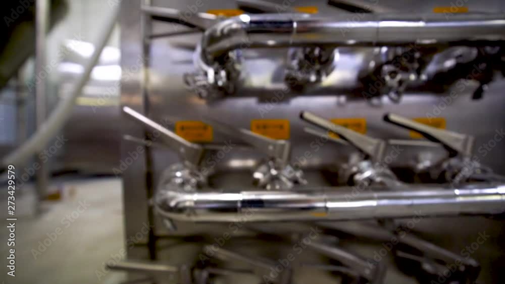 Closeup of a beer brewing machine inside a local brewery at Bornholm, Denmark. Closeup of a beer brewing machine inside a local brewery at Bornholm, Denmark.
