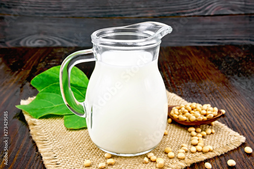 Milk soy in jug with beans on board