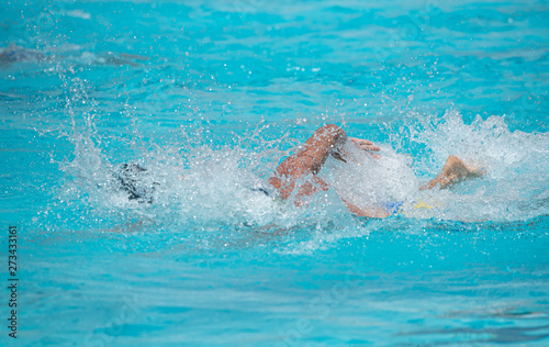 Athletes swimming on a swimming-pool
