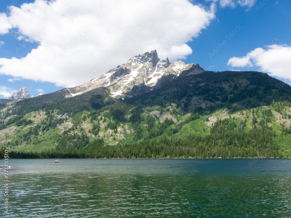 Fototapeta premium A fresh water lake in Montana with blue sky and clouds.