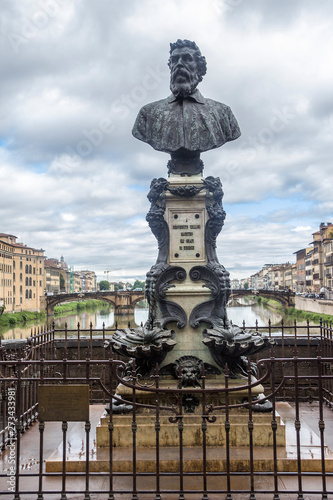 Italy, Florence. Ponte Vecchio bridge over the Arno River. Monument-fountain to the outstanding sculptor, jeweler and painter Benvenuto Cellini.