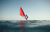Low angle view of windsurfer sailing on the sea