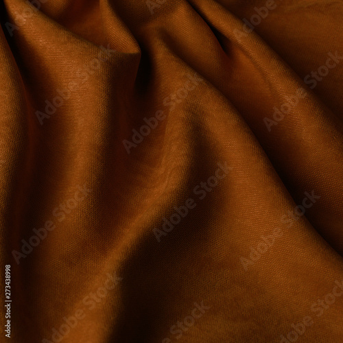 Monochrome decorative fabric velour rusty. Fabric with natural texture. Velour textiles. Cloth backdrop