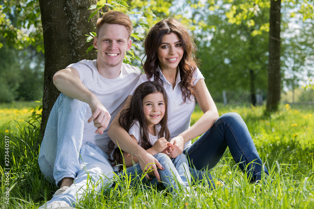 Portrait of happy family in park Portrait of happy family in park
