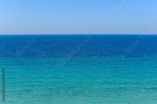 Calm blue sea and blue sky