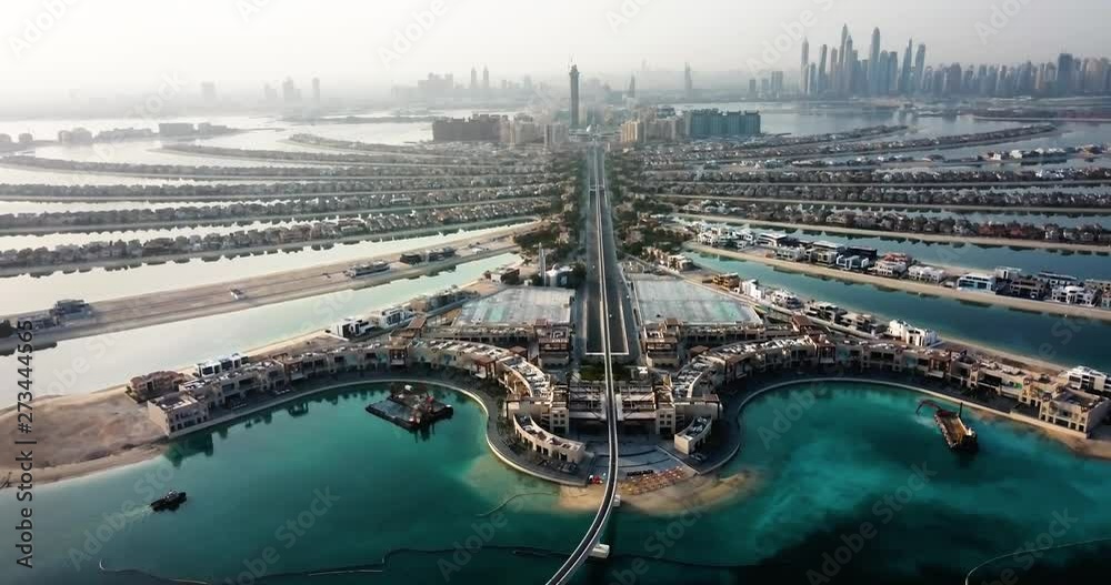 The Palm island with luxury villas and hotels in Dubai aerial view