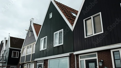Beautiful wooden houses. Typical small Dutch houses facades in Volendam, Netherlands