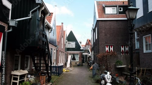 Typical small Dutch houses facades in Volendam. Beautiful architecture Volendam Netherlands 03.18.2019