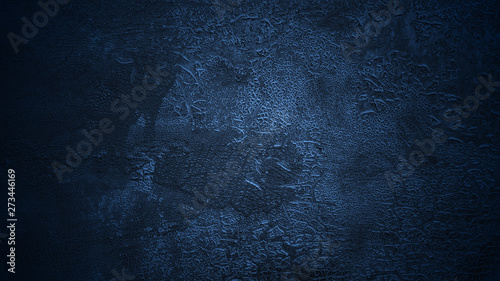 Shaded deep blue background. Old cracked surface. Aged flaking dyed leather texture