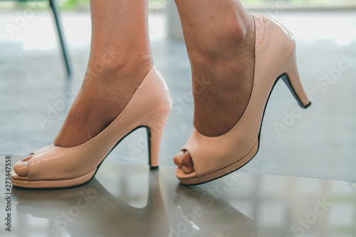 female woman legs wearing high heel shoes
