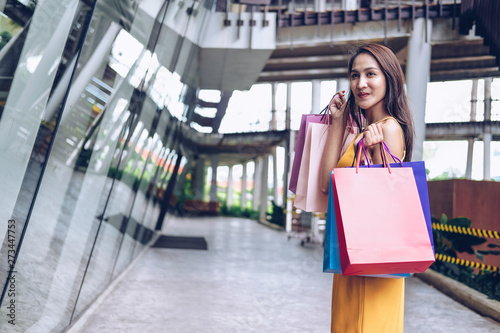 woman holding shopping bags. consumerism lifestyle in mall