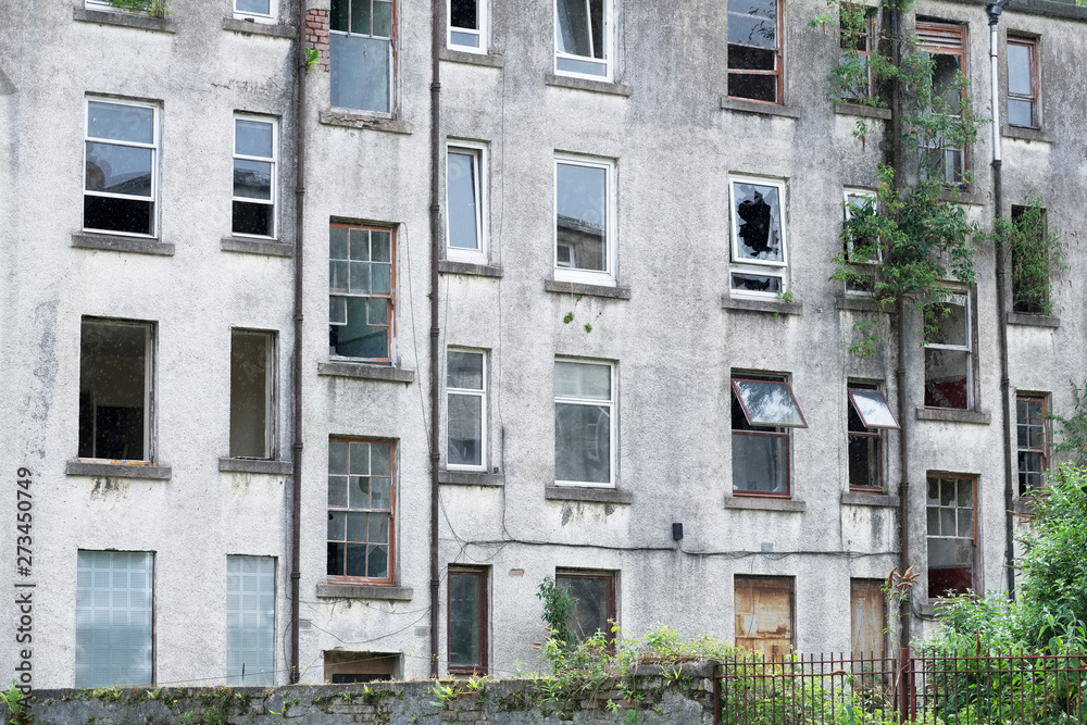 Fototapeta premium Poor council housing project now abandoned and derelict used by drug users as a squat