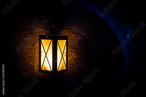 Arabic lantern with candle at night for Islamic holiday. Muslim holy month Ramadan. The end of Eid and Happy New Year. © zef art