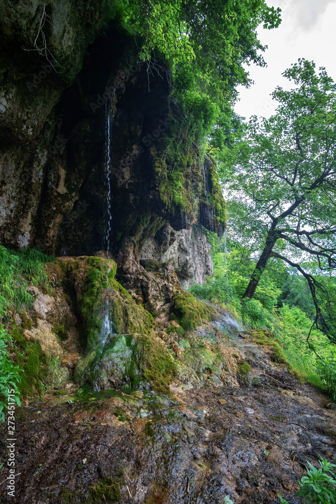 Mountain river waterfall landscape. Cascade of Dzhurynskyi waterfall.