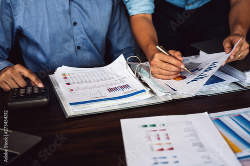 two businessman planning strategy on desk with paperwork, Strategist team analyze data or information.