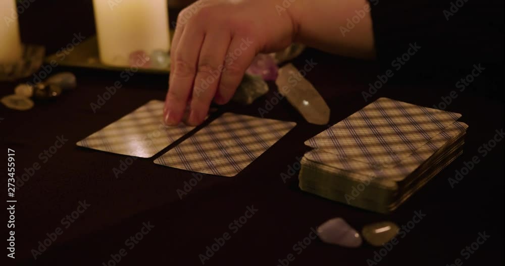 Close Up Taking Tarot Cards From Deck And Placing Them On Table And Turning Them Over Close Up Taking Tarot Cards From Deck And Placing Them On Table And Turning Them Over