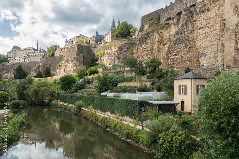Alzette river Luxembourg city downtown Grund with fortifications and gardens